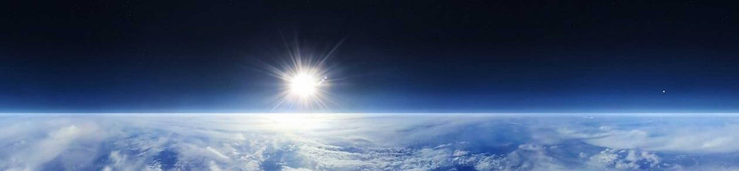 The sun shining over the vast, flat plane of Earth β the horizon stretches level and unbroken